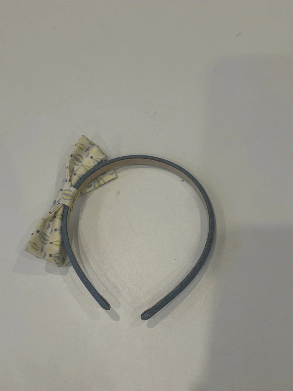 Blue Fabric Headband with Patterned Yellow Bow Accent